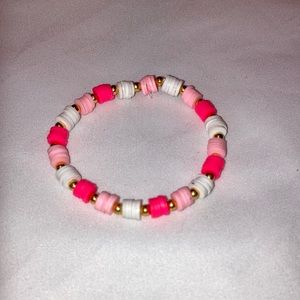 Hot pink, light pink, and white clay beaded bracelet